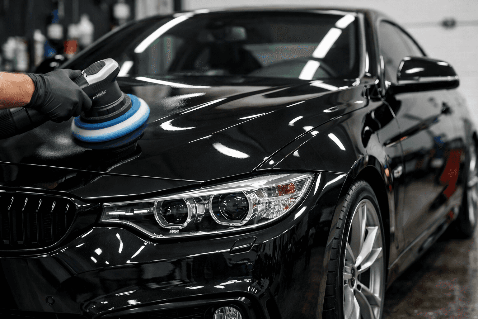 Machine paint correction polishing on black vehicle